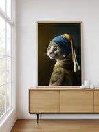 Pearl Earring Gray Cat framed above a sideboard